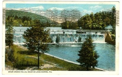 Vintage postcard view of a waterfall cascading over a dam at Bear Creek Falls near Wilkes-Barre, Pennsylvania, a site often linked to the history of the nearby Bischwind Villa.