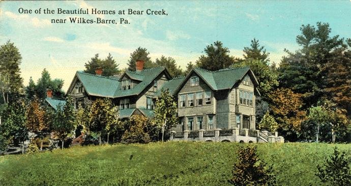 Vintage postcard of the Bischwind villa in Bear Creek, near Wilkes-Barre, Pennsylvania, a large house surrounded by trees.